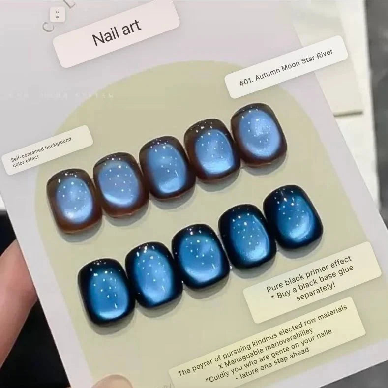 Blue autumn moon series magnetic cat eye gel polish creating a mesmerizing 3D nail effect with deep blue shimmer and reflective particles, producing a luminous cat eye line across the nail for an elegant professional gel manicure and dreamy reflective nail design.