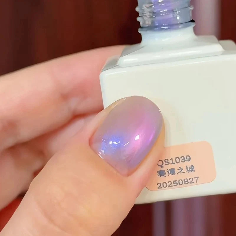 Jelly fish series magnetic cat eye gel polish creating a mesmerizing 3D nail effect with luminous shimmer and reflective particles, inspired by glowing jellyfish colors to produce a soft ocean-like reflective nail design for a professional gel manicure.