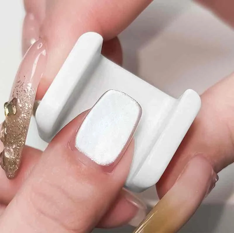 White magnetic cat eye stamper for nails, designed to create precise 3D magnetic nail designs with gel polish, acting as a nail art saver for flawless application, perfect for professional or DIY manicures, ensuring salon-quality results and enhanced creative control.